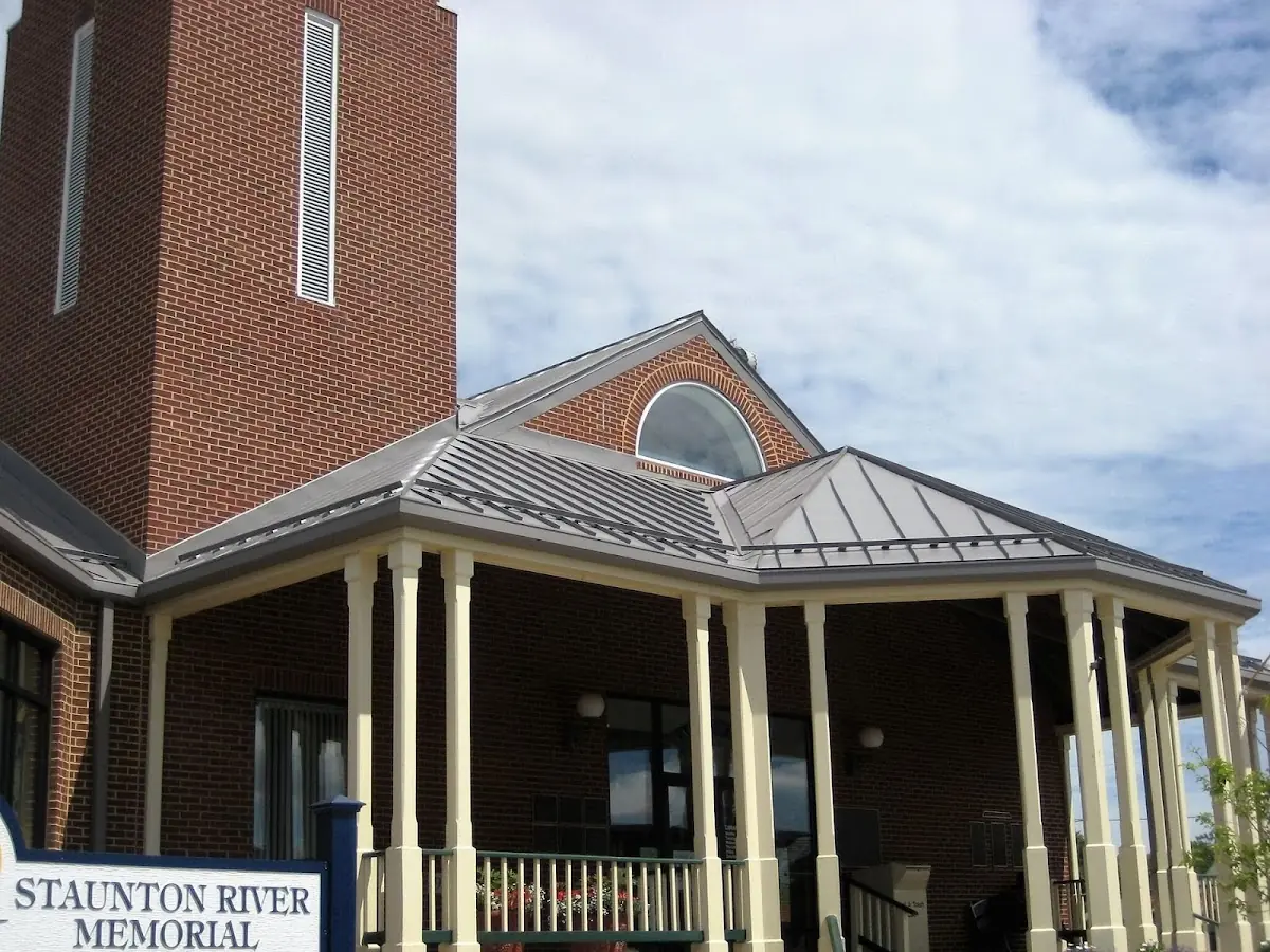 Skilled roofing craftsmen working on a residential roof in Petersburg